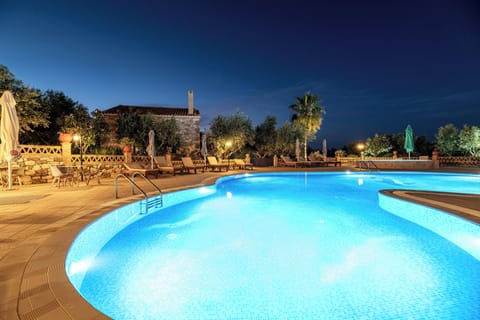 Seasonal outdoor pool, open 8:00 AM to 8:00 PM, pool umbrellas