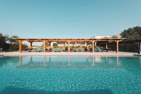 Seasonal outdoor pool, open 8:00 AM to 7:00 PM, pool umbrellas