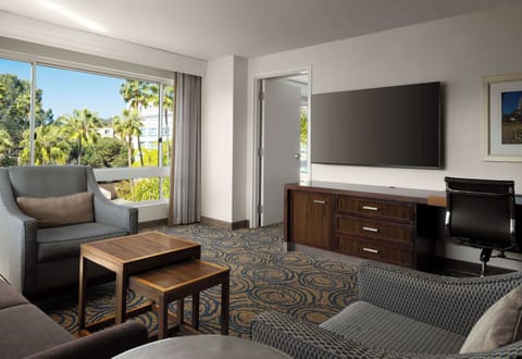 Bedroom King Suite | Living area | 65-inch LCD TV with digital channels, TV, Netflix