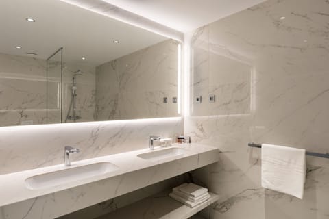 Shower, hair dryer, slippers, towels