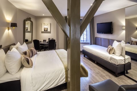 Triple Room | Pillowtop beds, minibar, in-room safe, individually decorated