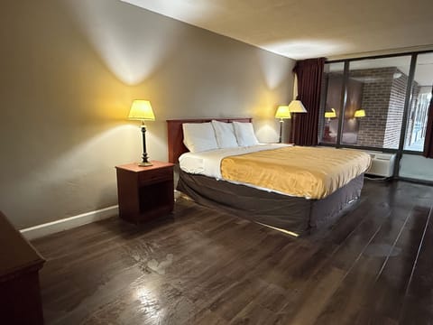 Premium bedding, desk, laptop workspace, iron/ironing board