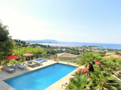 Seasonal outdoor pool, open 8:00 AM to 9:00 PM, pool umbrellas