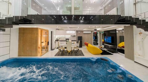 Deluxe Suite, 2 Bedrooms, Private Pool | Living area | 49-inch LED TV with digital channels, TV, tablet