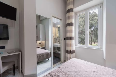 Economy Double Room | 1 bedroom, premium bedding, minibar, in-room safe