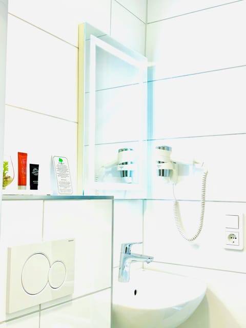 Shower, free toiletries, hair dryer, slippers