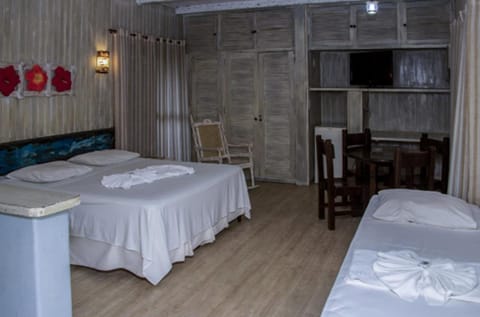 Quadruple Room | Minibar, in-room safe, blackout drapes, iron/ironing board