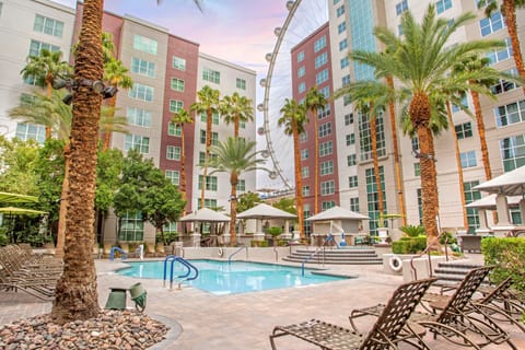 Outdoor pool, open 8:00 AM to 10:00 PM, sun loungers