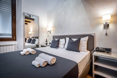 Deluxe Suite | Premium bedding, down comforters, minibar, desk