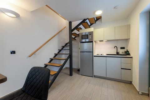 Deluxe Duplex, Terrace, City View | Private kitchen | Electric kettle, highchair