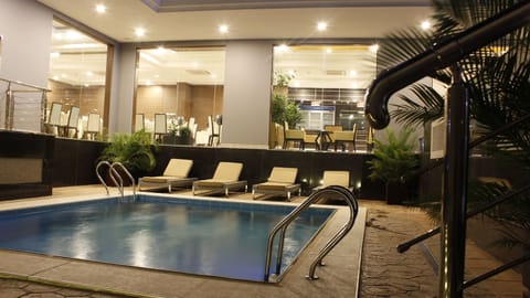 Outdoor pool, pool umbrellas, sun loungers
