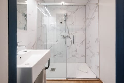 Shower, free toiletries, hair dryer, towels