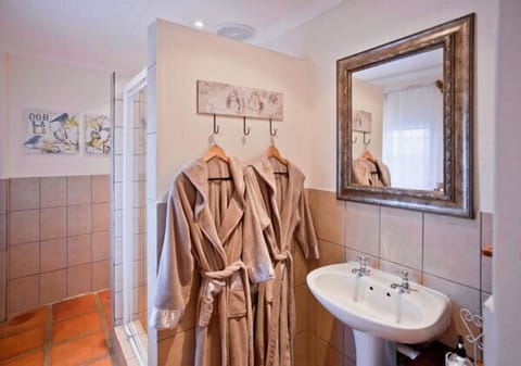 Designer toiletries, hair dryer, bathrobes, towels