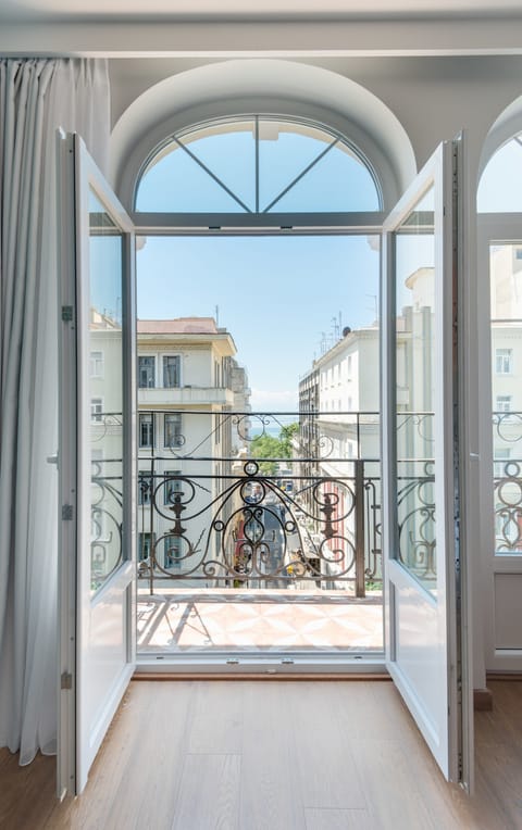 Double Room, Partial Sea View (Large) | In-room safe, individually decorated, desk, blackout drapes