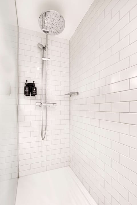 Shower, rainfall showerhead, designer toiletries, hair dryer