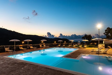 Seasonal outdoor pool, open 9:00 AM to 6:00 PM, pool umbrellas