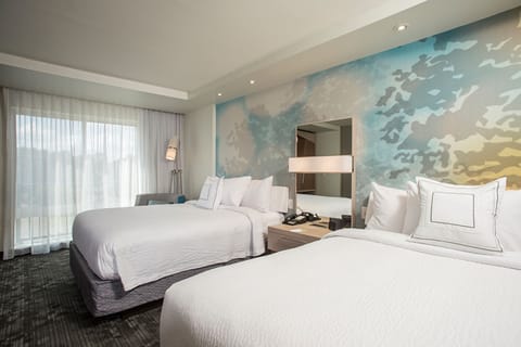 Premium bedding, desk, laptop workspace, blackout drapes