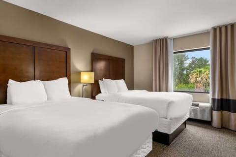 Suite, Multiple Beds, Non Smoking | Laptop workspace, iron/ironing board, free WiFi, bed sheets