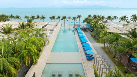 Outdoor pool, open 7:00 AM to 11:00 PM, pool umbrellas, sun loungers