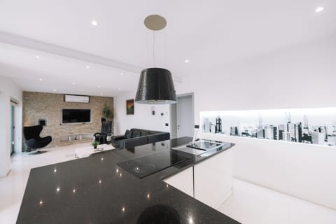 Superior Apartment | Living area | Flat-screen TV