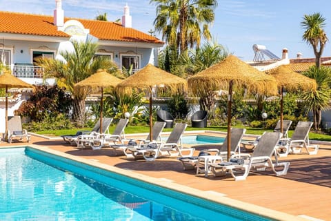 Outdoor pool, open 10:00 AM to 6:00 PM, pool umbrellas, sun loungers