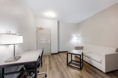 Suite, 1 King Bed (2 Rooms, Smoke Free) | Desk, laptop workspace, blackout drapes, iron/ironing board