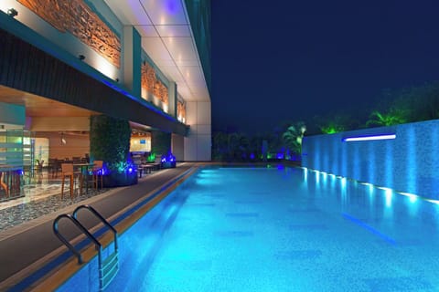 Outdoor pool, open 6:00 AM to 11 PM, free cabanas, pool umbrellas
