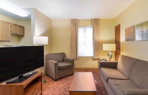 Premium bedding, desk, laptop workspace, blackout drapes