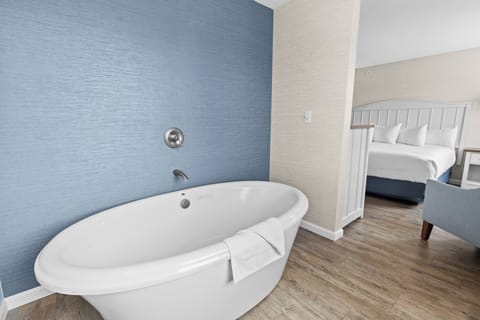 Desk, laptop workspace, blackout drapes, iron/ironing board