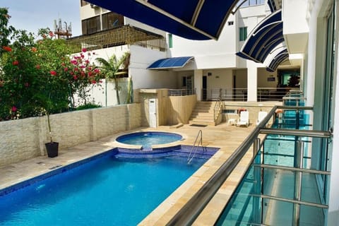 Outdoor pool, pool umbrellas, sun loungers