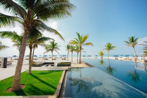 Outdoor pool, open 7:00 AM to 7:00 PM, free cabanas, pool umbrellas