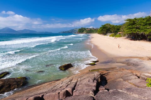 Beach nearby, white sand, surfing