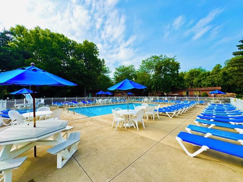 Seasonal outdoor pool, open 10:00 AM to 10:00 PM, pool umbrellas