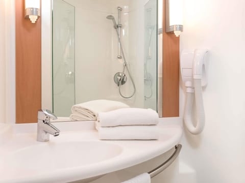 Shower, eco-friendly toiletries, hair dryer, towels