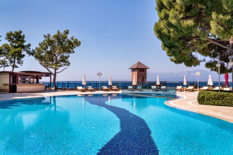 Indoor pool, seasonal outdoor pool, pool umbrellas, sun loungers