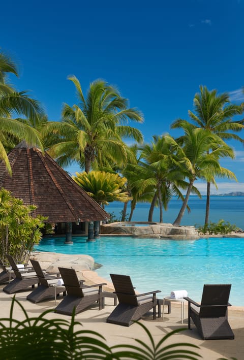 Outdoor pool, pool umbrellas, sun loungers
