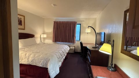 Deluxe Room, 1 Bedroom | Desk, blackout drapes, iron/ironing board, free WiFi