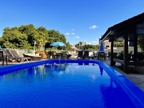 2 outdoor pools, open 8:00 AM to 11:00 PM, pool umbrellas, sun loungers