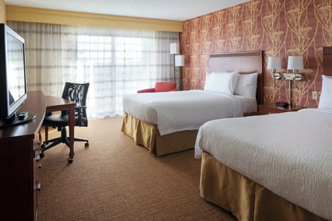 Premium bedding, desk, laptop workspace, blackout drapes