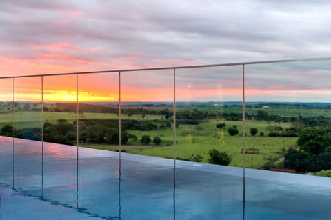 Outdoor pool, open 6:00 AM to 10:00 PM, sun loungers