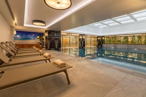 Indoor pool, open 7:00 AM to 10:00 PM, sun loungers