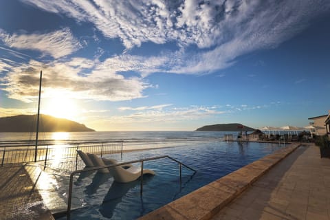 Outdoor pool, open 9:00 AM to 9:00 PM, sun loungers