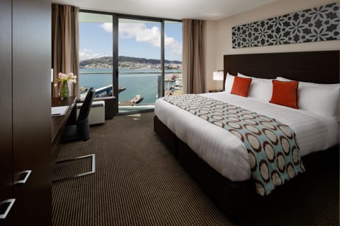 Deluxe Room, 1 King Bed, Harbor View | Minibar, in-room safe, desk, blackout drapes