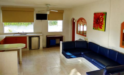 Junior Suite, 2 Bedrooms, Poolside | Living room | 32-inch TV with cable channels