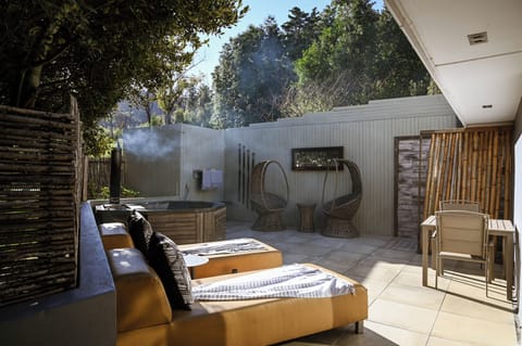 Deluxe Suite, 1 King Bed, Courtyard View, Garden Area | Premium bedding, minibar, in-room safe, individually decorated