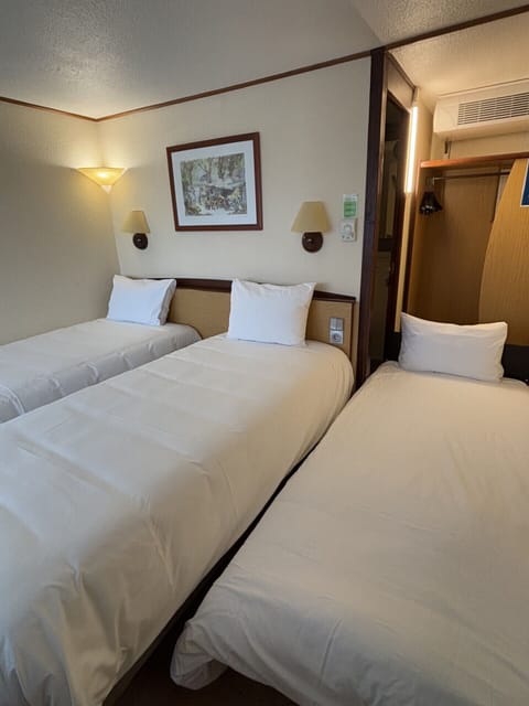 Standard Room - 2 Single Beds 1 Junior Bed up to 10 years | Premium bedding, desk, blackout drapes, iron/ironing board