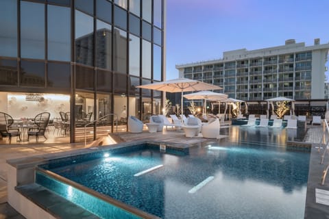 Outdoor pool, open 8:00 AM to 10:00 PM, free cabanas, pool umbrellas