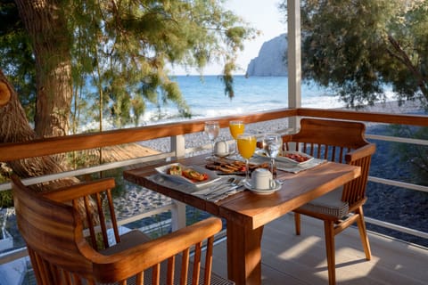 Private beach, black sand, sun loungers, beach umbrellas