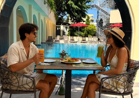 Seasonal outdoor pool, open 10:00 AM to 7:00 PM, sun loungers