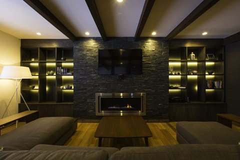 7 bedroom House (3 Double, 6 Single, 6 bunk beds)	 | Living area | Flat-screen TV, fireplace